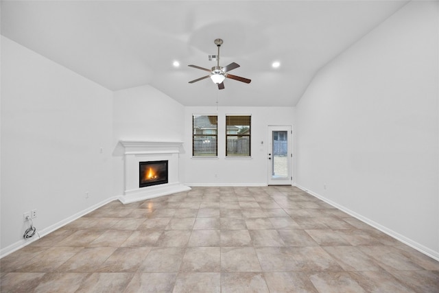 unfurnished living room featuring lofted ceiling and ceiling fan