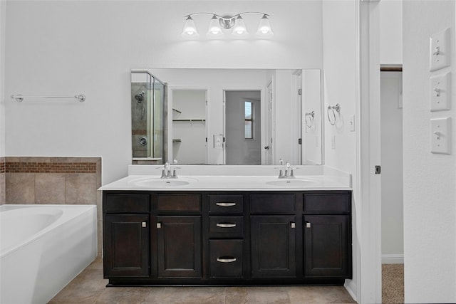 bathroom with vanity and separate shower and tub