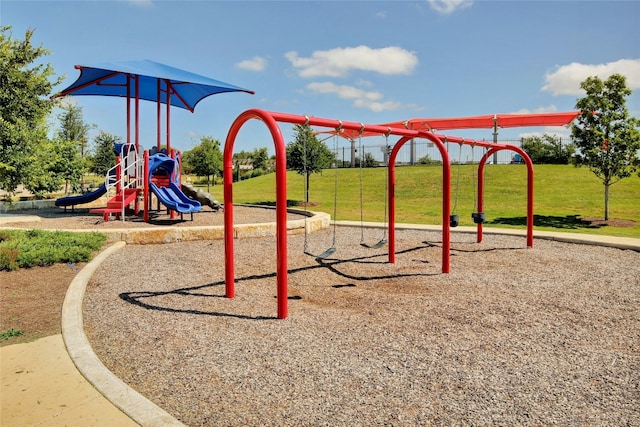 view of playground with a lawn