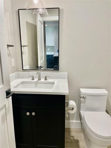 bathroom with vanity and toilet