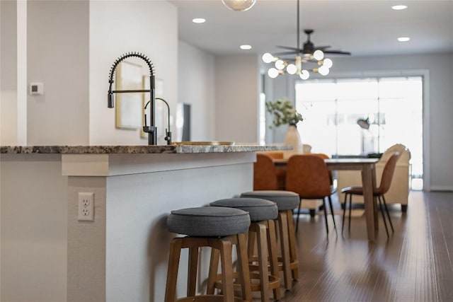 kitchen with dark hardwood / wood-style floors