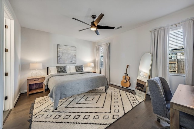 bedroom featuring ceiling fan and dark hardwood / wood-style flooring