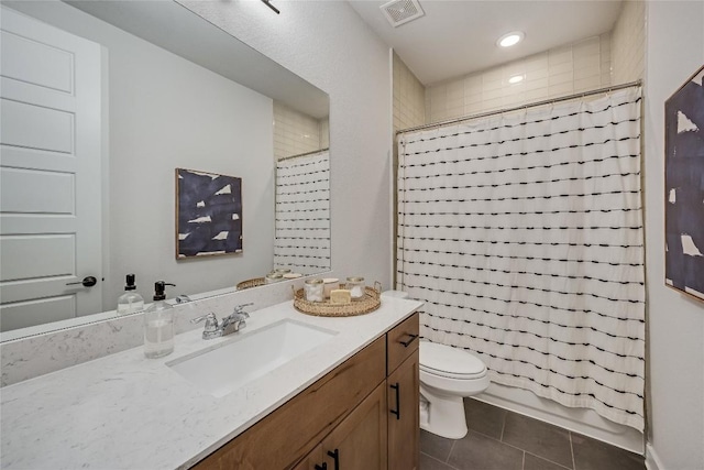 full bathroom featuring tile patterned flooring, vanity, shower / bath combination with curtain, and toilet