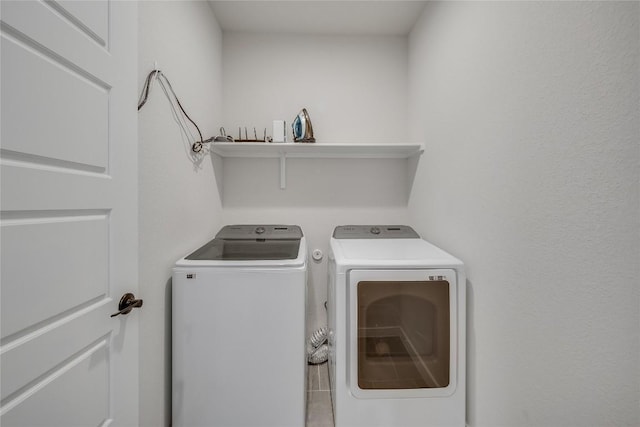 laundry room featuring washer and clothes dryer