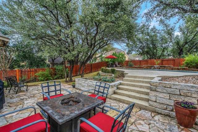 view of patio / terrace featuring a fire pit