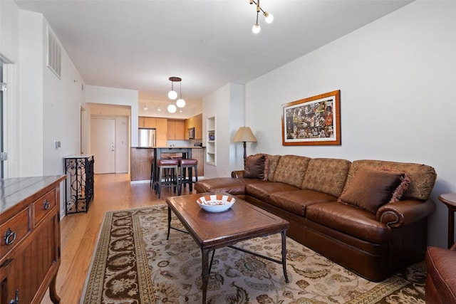 living room with light hardwood / wood-style flooring