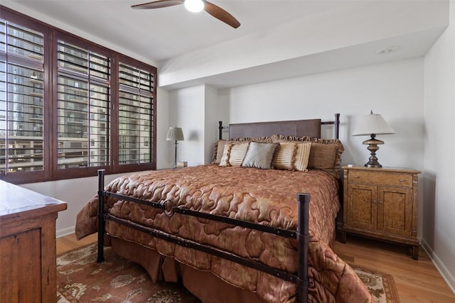 bedroom with hardwood / wood-style flooring and ceiling fan