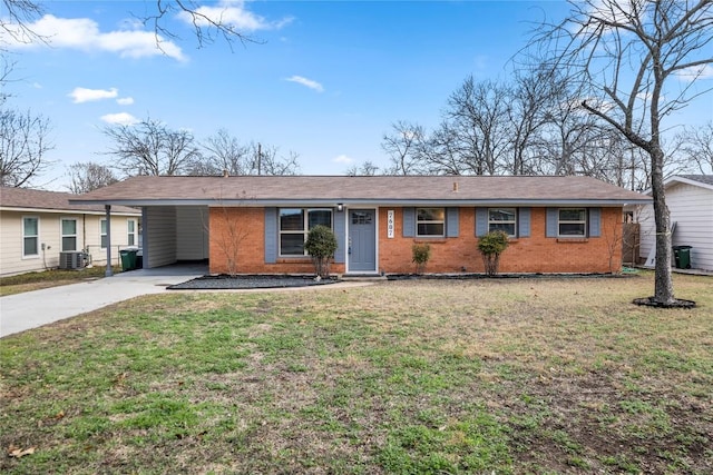 ranch-style home with a carport, central air condition unit, and a front lawn