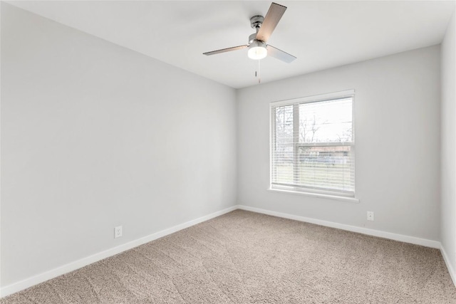 spare room with ceiling fan and carpet floors