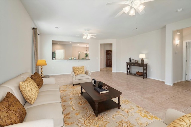 tiled living room with ceiling fan