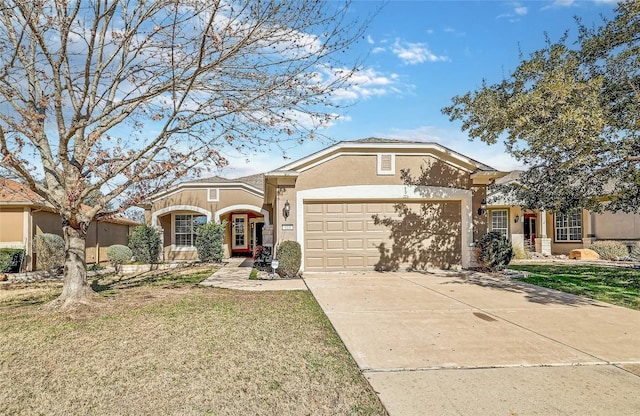 view of front of house with a garage and a front yard