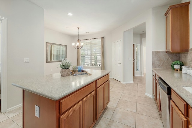 kitchen featuring light tile patterned flooring, a center island, hanging light fixtures, stainless steel dishwasher, and decorative backsplash