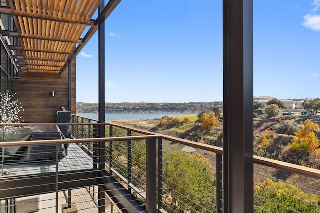 balcony featuring a water view