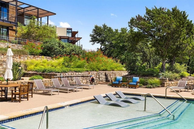 view of swimming pool featuring a patio