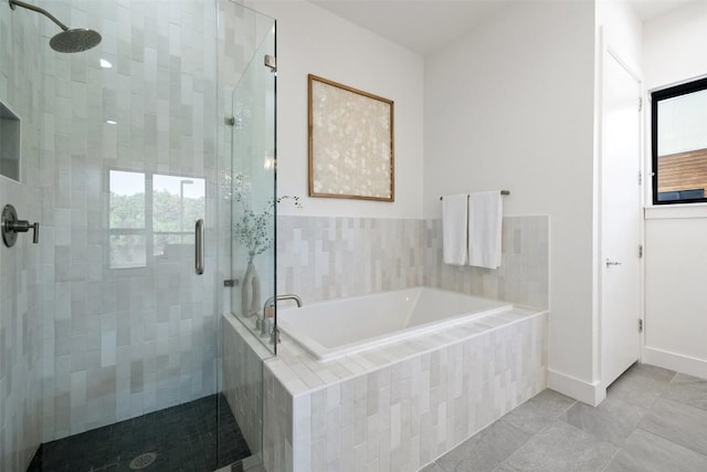 bathroom featuring shower with separate bathtub and tile patterned floors