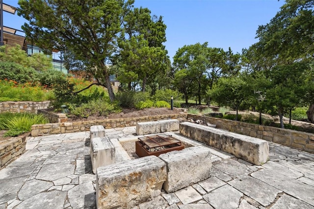 view of patio with a fire pit