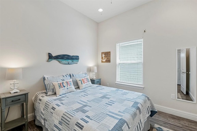 bedroom with hardwood / wood-style flooring