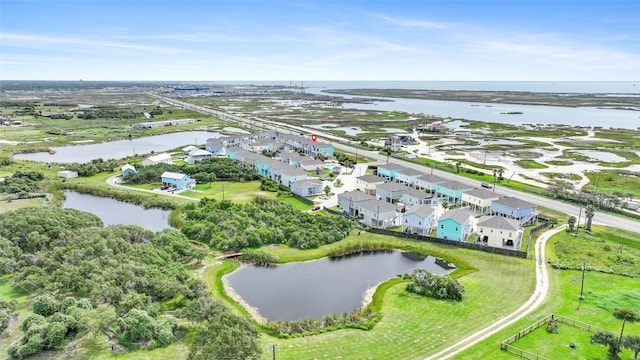 drone / aerial view with a water view