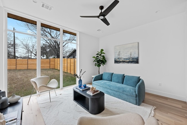 1409 Valleyridge Dr Unit B, Austin, TX 78704 - living room featuring healthy amount of natural light, wood finished floors, and ceiling fan