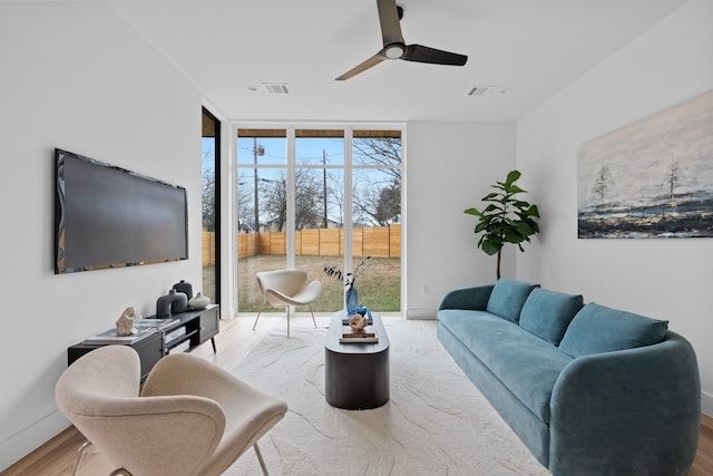 1409 Valleyridge Dr Unit B, Austin, TX 78704 - living room featuring floor to ceiling windows, a ceiling fan, and wood finished floors