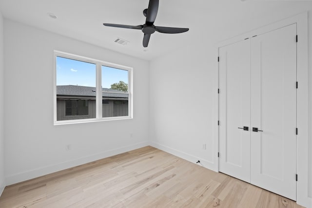 1409 Valleyridge Dr Unit B, Austin, TX 78704 - unfurnished bedroom with light wood-style flooring, a ceiling fan, and a closet