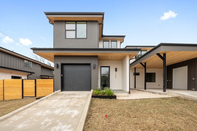 1409 Valleyridge Dr Unit B, Austin, TX 78704 - contemporary house with stucco siding, concrete driveway, and an attached garage