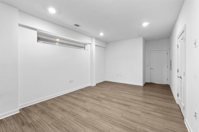 unfurnished room with light hardwood / wood-style flooring