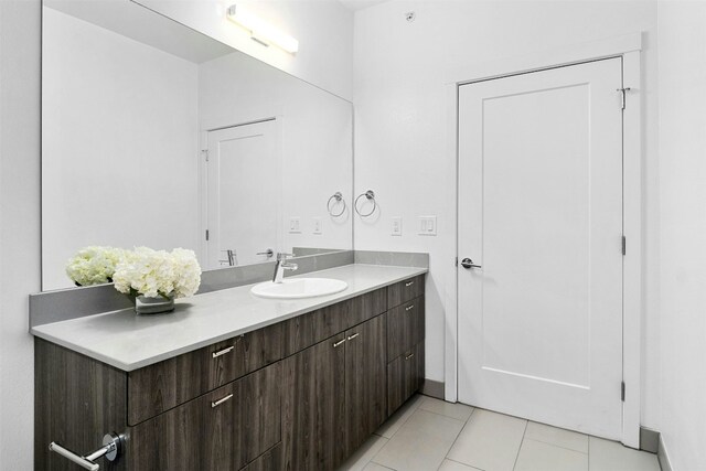 bathroom featuring tile patterned flooring and vanity