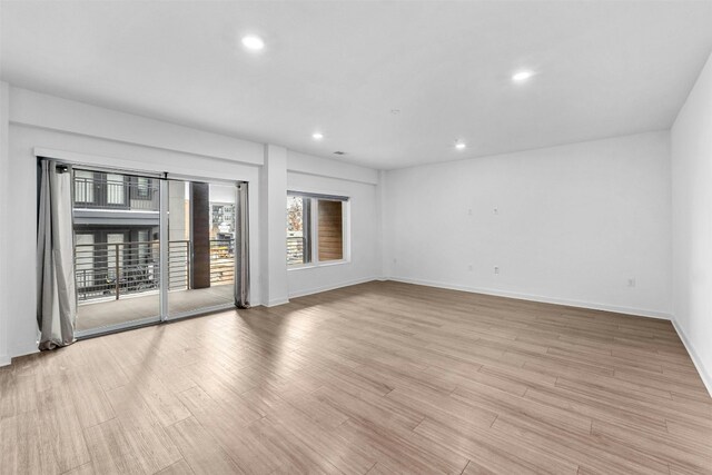 unfurnished room with light hardwood / wood-style floors