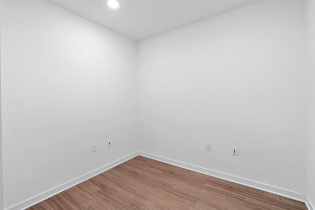 spare room featuring hardwood / wood-style flooring