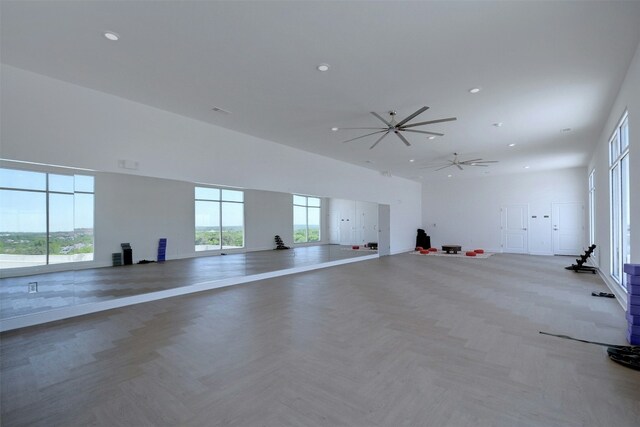 interior space with parquet flooring and a high ceiling