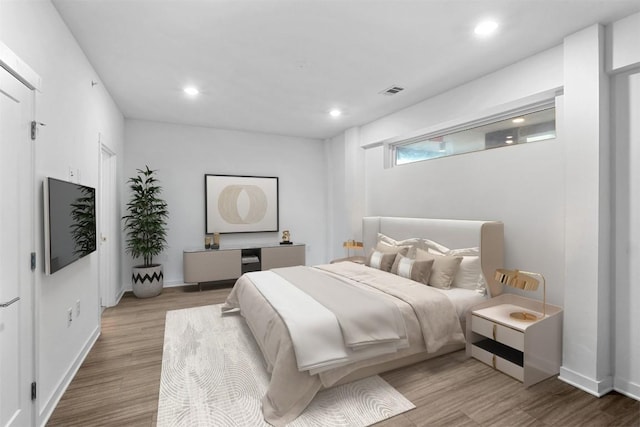 4361 S Congress Ave Unit 333, Austin, TX 78745 - bedroom featuring wood finished floors and recessed lighting