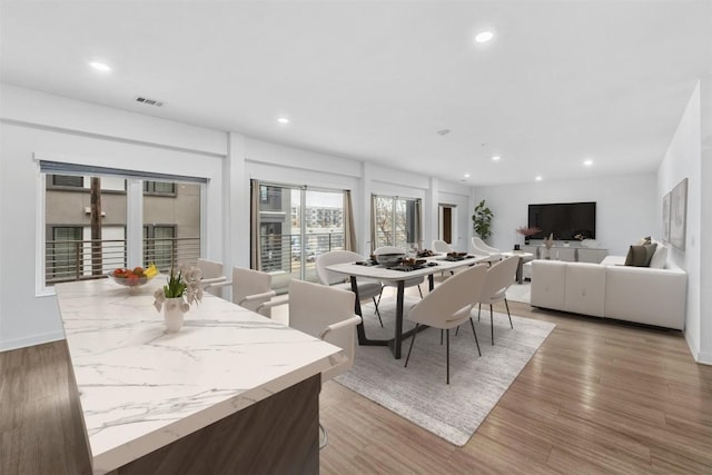 4361 S Congress Ave Unit 333, Austin, TX 78745 - dining area featuring light wood finished floors and recessed lighting