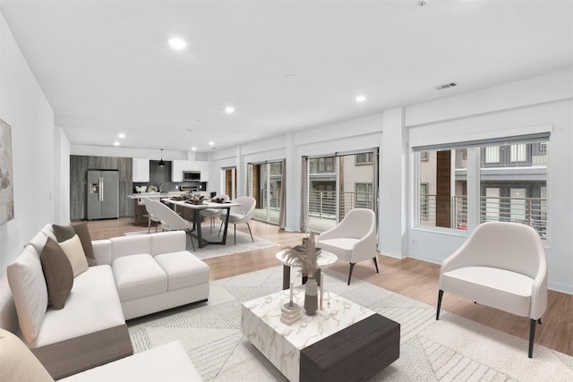 4361 S Congress Ave Unit 333, Austin, TX 78745 - living area with recessed lighting and light wood-style flooring
