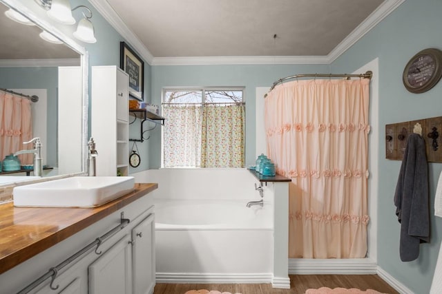 bathroom with crown molding, vanity, and plus walk in shower