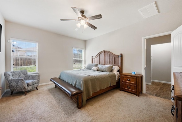 bedroom featuring light carpet and ceiling fan