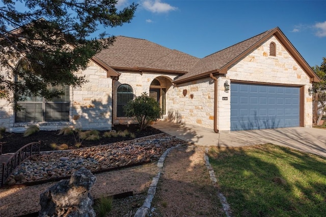 ranch-style house featuring a garage