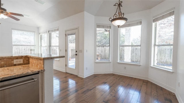 interior space featuring ceiling fan, stainless steel dishwasher, dark hardwood / wood-style floors, and a healthy amount of sunlight