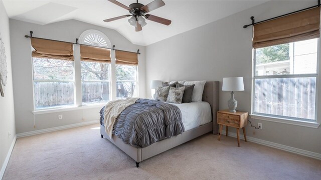 carpeted bedroom with ceiling fan and lofted ceiling