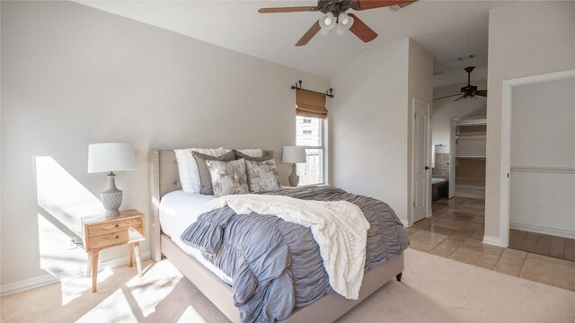 tiled bedroom featuring ceiling fan