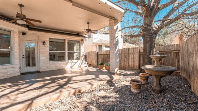 view of patio featuring ceiling fan