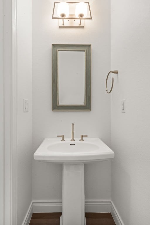 bathroom with sink and hardwood / wood-style floors