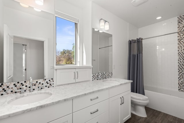 5 Crystal Springs Ct Unit A, The Hills, TX 78738 - bathroom with double vanity, toilet, wood finished floors, and shower / tub combo with curtain