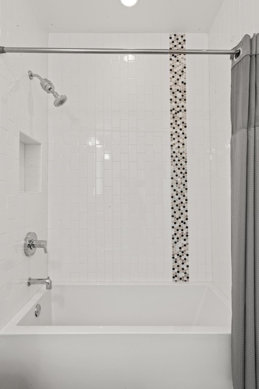 bathroom with shower / bath combination with curtain