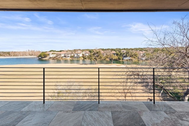 balcony featuring a water view