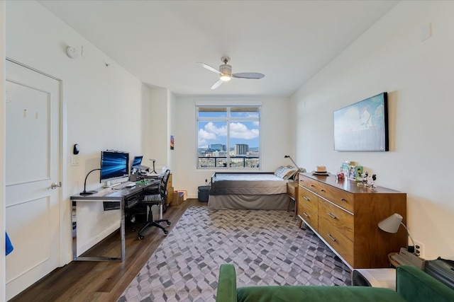 bedroom with ceiling fan and dark hardwood / wood-style floors