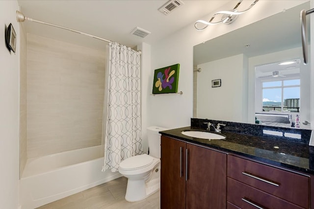 full bathroom with vanity, toilet, and shower / bath combo with shower curtain