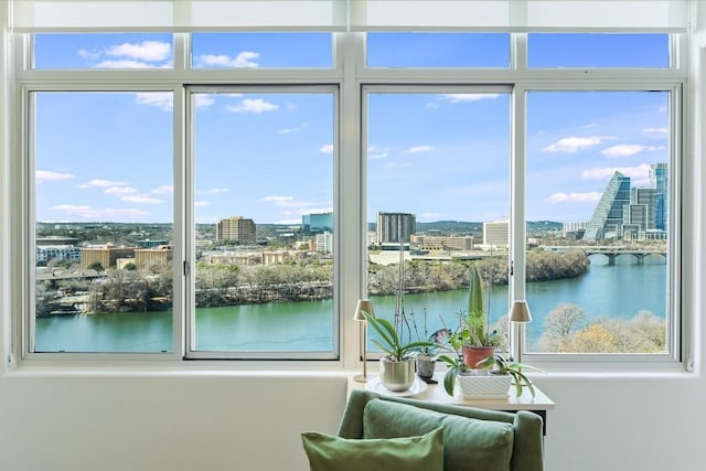 entryway featuring a water view and a healthy amount of sunlight