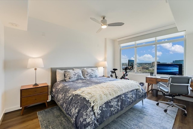 bedroom with ceiling fan and wood-type flooring