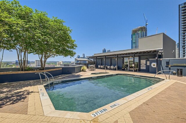 view of swimming pool with a patio